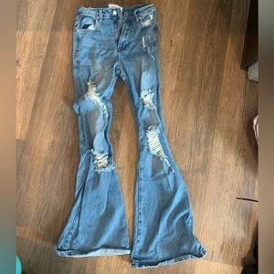 I am selling a pair of my ripped flare jeans.